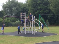 Children playing on a climbing frame at Gobowen PLaying fields.
